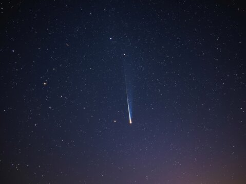 Shooting star in night sky - Powered by Adobe
