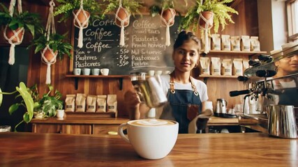 Barista pouring coffee in a cozy caf? setting