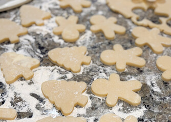 Sugar Cookies Being Rolled and Cut Out on the Kitchen Counter