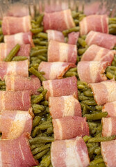 Raw Fresh Green Bean Bundles Wrapped in Bacon Ready to be Cooked