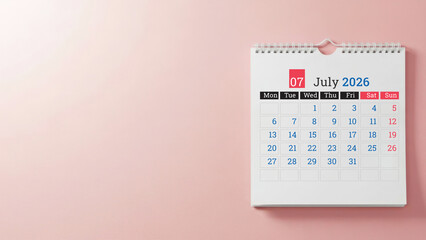 July 2026 wall calendar on pastel pink background with copy space