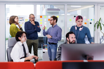Business team collaboration in a modern office setting during a brainstorming session for a project