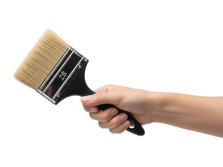 A hand firmly holding a black handled paintbrush with golden bristles