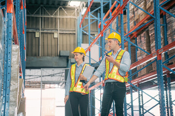 Caucasian man, woman warehouse supervisor wear safety discuss,talk and use clipboard check box package on shelf, product distribution inventory management,Logistics shipping business planning industry