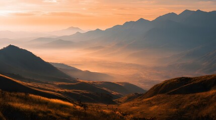 Obraz premium Majestic Mountain Range at Sunset - A Breathtaking Landscape of Golden Hues and Silhouettes.
