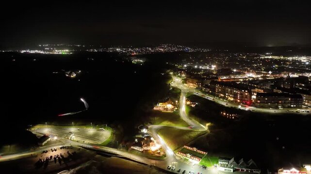 Drone hyperlapse of Saltburn by the sea flying a parallax focus on the hill with car light trails, taken early morning in December 2025