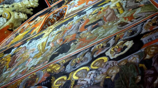 Masterpieces of Byzantine hagiography: detailed frescoes inside a Meteora monastery. These historic wall paintings represent the pinnacle of Eastern Orthodox religious art