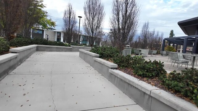 A POV stroll across the Stanislaus State campus showcases trees, lecture halls, and pedestrian paths, offering a natural sense of scale and movement through this Central Valley college setting.