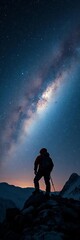 Fototapeta premium Summit climber gazes at Milky Way, a rewarding, solitary night , summit, beauty