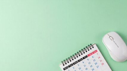 Office planning and technology essentials on green background with copy space