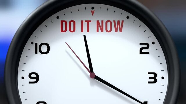 Do It Now that is going to happen soon. Upcoming do it now, approaching in the near future. Do It Now almost here, in a short time - a clock symbolizes a reminder that do it now is near.