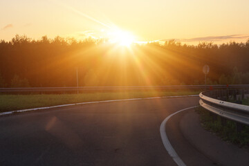 orange evening views of the road highway on a sunny day in summer. 