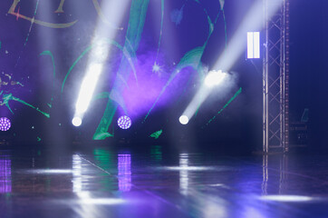 Сoncert on scene theater, stage light with colored spotlights and smoke.