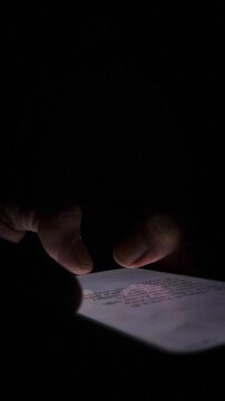Night, cybersecurity and hands typing with phone for texting, internet troll or person cyberbullying. Dark comment, social media netizen or keyboard warrior, online bullying or hacking. vertical.