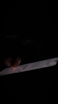 Night, cybersecurity and hands typing with phone for texting, internet troll or person cyberbullying. Dark comment, social media netizen or keyboard warrior, online bullying or hacking. vertical.