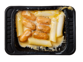 A tray of food with noodles and meatballs