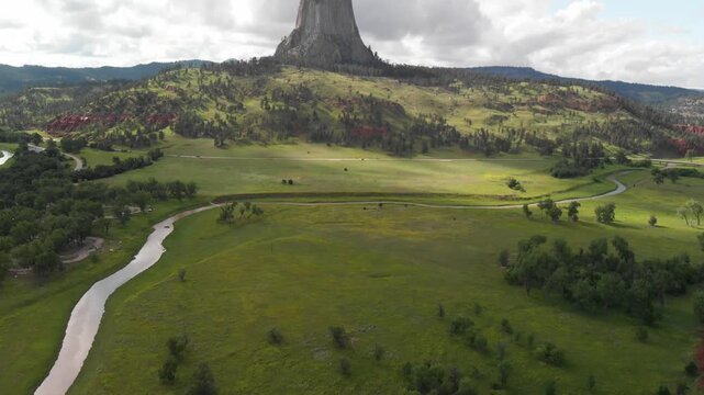 Devil's Tower National Monument and surrounding landscape in summer season. Beautiful aerial view on a sunny afternoon