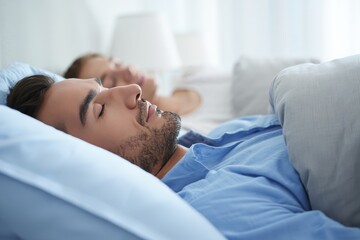 Couple Sleeping Peacefully in Bed - Healthy Sleep and Rest