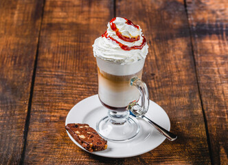 Flavored latte topped with whipped cream and syrup