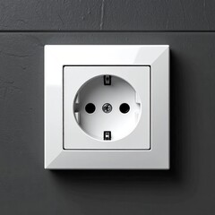 White electrical outlet on dark gray wall