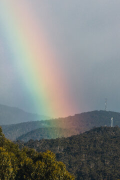 serene morning rainbow over tasmania mountains and hills, unedited apart from color grading