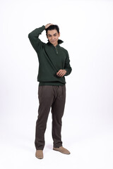 Businessman in a dark sweater standing and looking thoughtful