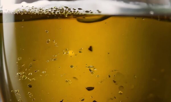 This enticing video showcases a close-up of a refreshing glass of beer, highlighting its golden color and sparkling bubbles. Viewers are invited to savor the moment, exploring the rich flavors and cra