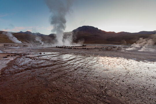 Geysir and hot water springs at El Tatio in Chile before sunset