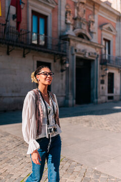 Tourist sightseeing at Plaza de la Villa Madrid on a sunny day