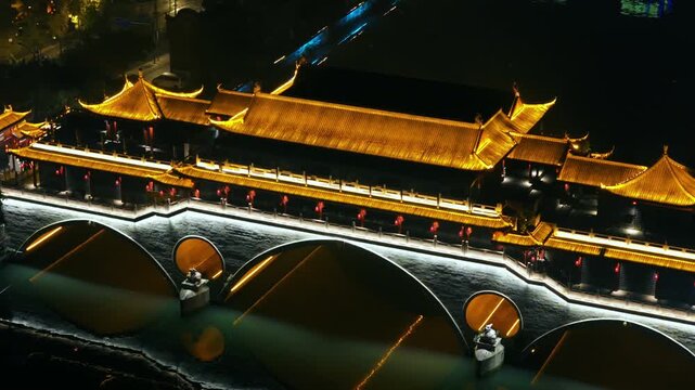 Illuminated Anshun Bridge At Night Crossing The Jin River In Chengdu, China. Aerial Shot