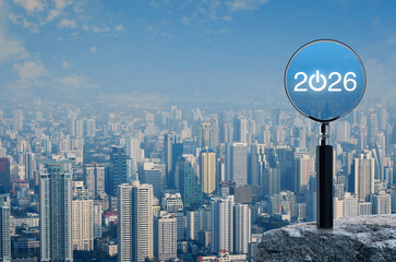 2026 start up flat icon with magnifying glass on rock mountain over modern city tower, office building and skyscraper, Business happy new year 2026 success concept