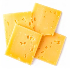 Overhead view of sliced, yellow cheese arranged against a white backdrop