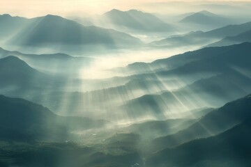 A breathtaking view of a mountain range, with the sun casting a warm glow over the peaks and valleys, creating a serene atmosphere.