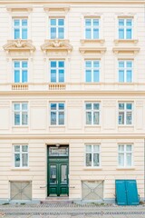 Obraz premium Classic Scandinavian Building Facade with Green Basement Door in Copenhagen, Denmark