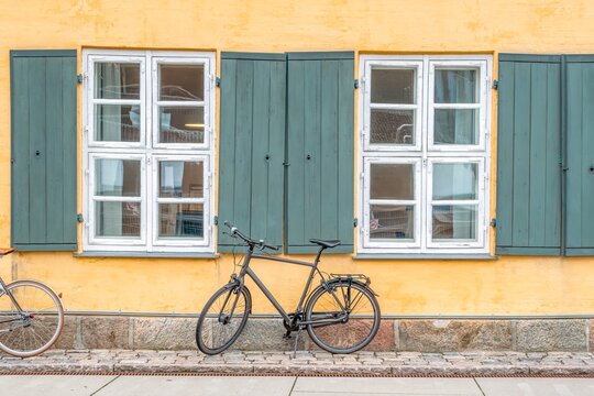 Bicycle Parked by Historic Yellow Nyboder District Houses in Copenhagen