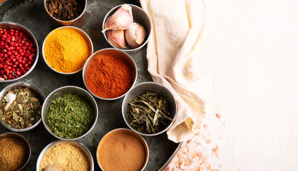 Different aromatic spices in bowls.