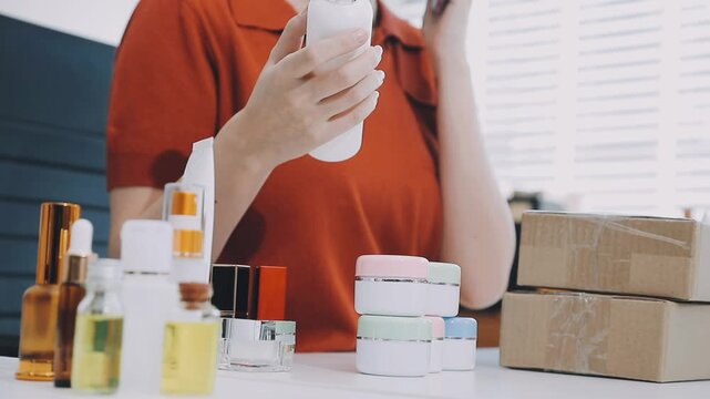 Asian woman beauty Vlogger live broadcasting cosmetic makeup tutorial sharing on social media. Business online influencer on social media concept. Online Selling. Online Shopping.