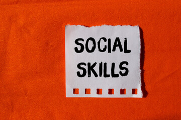 Social skills message written on ripped torn paper background. Conceptual Social skills symbol. Copy space.