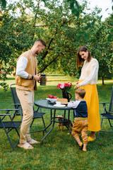 Happy Family Having Picnic Together Outdoors