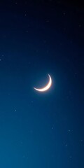 Fototapeta premium Vast dark blue night sky adorned with a glowing crescent moon and twinkling stars, ideal for Islamic festive cards, blue, night
