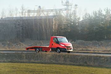 Empty tow truck on roadside in sunlight