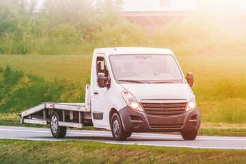 Empty roadside recovery truck in late light