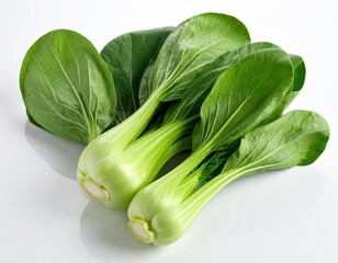 Fresh, vibrant green leafy vegetables on a reflective white surface