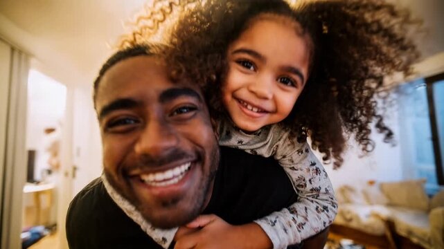 Happy father hugs smiling daughter while taking selfie at home capturing warm family love joy and authentic everyday life moment