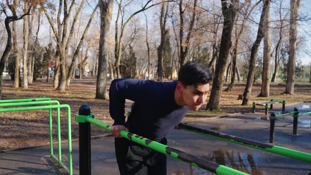 Close up of athlete's hands on parallel bars during workout.