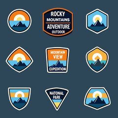 Obraz premium Rocky mountain adventure badges and national park emblem designs displayed