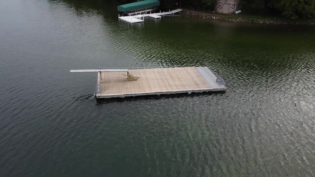 Raft with diving board on lake 