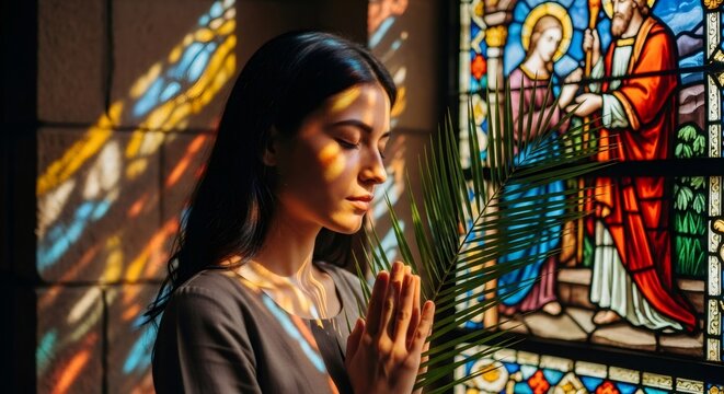 Woman praying with palm branch in church. Palm Sunday celebration. Religious devotion and spiritual reflection.