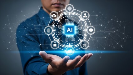 Close-up of a man in a blue shirt holding out his hand with a glowing blue AI interface and icons floating above it against a dark background with a futuristic feel.