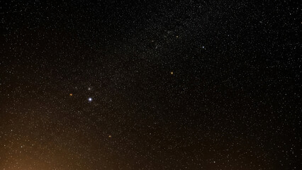 A stethoscope rests on a stack of textbooks with a blurred background in a medical educational setting for a health professional.